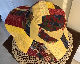 Reversible patchwork bucket hat with red lining, small quilt top hat