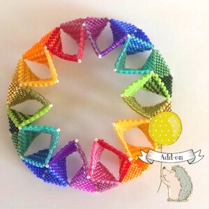 May include: A rainbow colored beaded bracelet made of small, square beads. The bracelet is made of a series of connected triangles. The bracelet is in the shape of a circle. The bracelet is on a white background. Add-on is written on a banner held by a cartoon hedgehog.