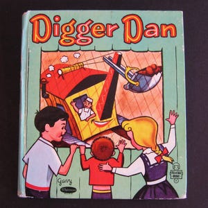 May include: Vintage children's book titled "Digger Dan." The cover features a colorful illustration of a construction scene with three children looking on. The title is in orange and yellow lettering against a teal background.