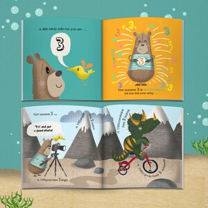 May include: A children's book open to three pages with illustrations. The first page shows a bear and bird with the number 3 in a speech bubble. The second page has a bear with the number 3 and text. The third page shows a bear with a camera and a dinosaur on a tricycle.