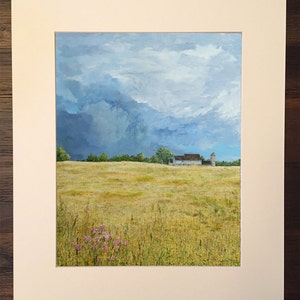 May include: A painting of a white farmhouse with a silo in a field of golden grass under a cloudy sky.