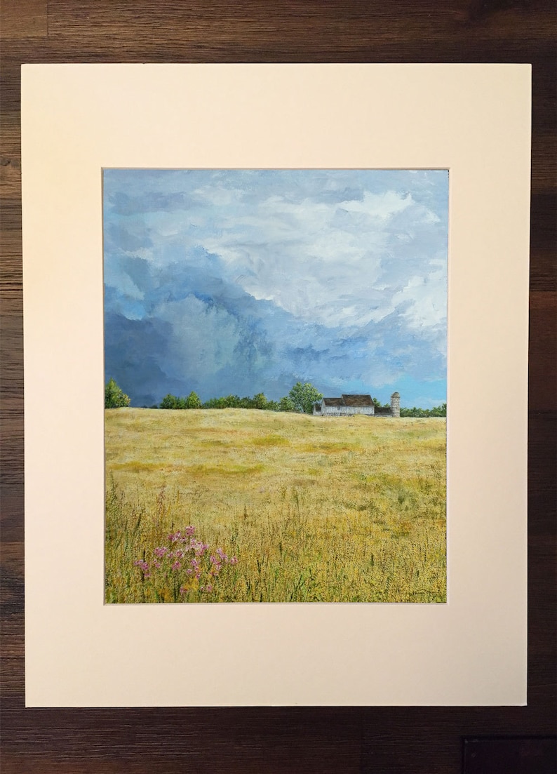 May include: A painting of a white farmhouse with a silo in a field of golden grass under a cloudy sky.