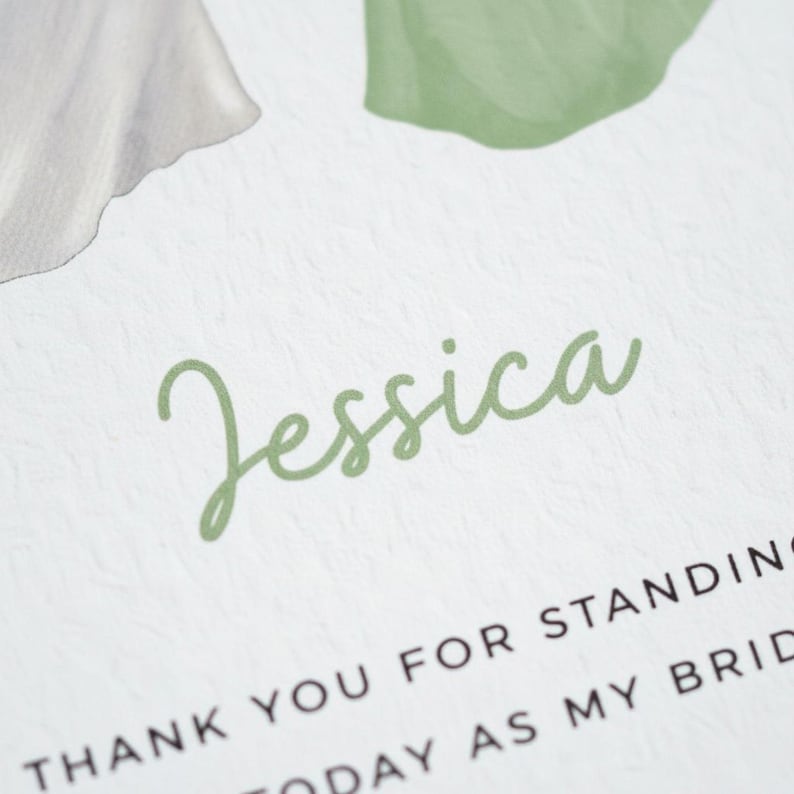 A close-up of a printed card with the name " Jessica" written in cursive font.