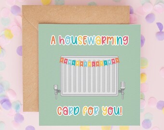 May include: A square greeting card with a light green background featuring a white radiator illustration. A colorful banner across the radiator reads CONGRATULATIONS. The text A HOUSEWARMING CARD FOR YOU! is printed in multicolored letters.