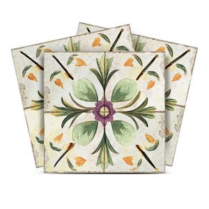 May include: Three vintage-style ceramic tiles with a floral design. The tiles feature a central purple flower with green leaves and yellow accents on a white background.