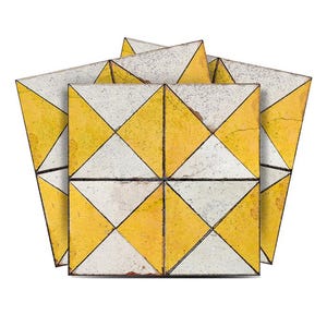 May include: Four yellow and white ceramic tiles with a geometric diamond pattern. The tiles have a distressed, vintage look.