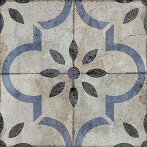 May include: Square tile with a distressed, aged appearance. The design features a central floral motif with dark gray petals and a circular center. Light blue curved shapes and leaf accents complete the pattern, set against a neutral, off-white background.