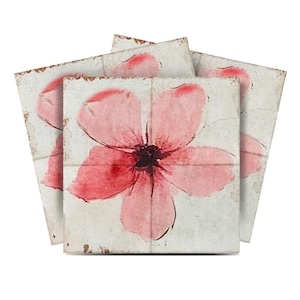 May include: Set of four ceramic coasters featuring a pink watercolor flower design on a white background with a distressed look.