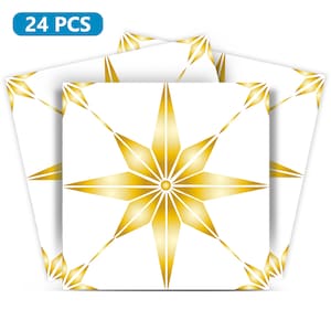 Może przedstawiać: 24 złotych naklejek w kształcie gwiazd na białym tle. Gwiazdy mają geometryczny wzór.