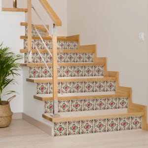May include: A set of decorative stair treads with a floral pattern in shades of pink, green, and cream. The treads are made of a durable material and are easy to apply.