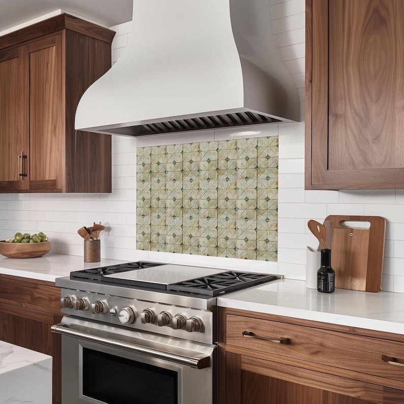 May include: A modern kitchen featuring a stainless steel range with a white range hood. The backsplash is tiled with a repeating geometric pattern. Dark wood cabinets and white countertops complete the design.