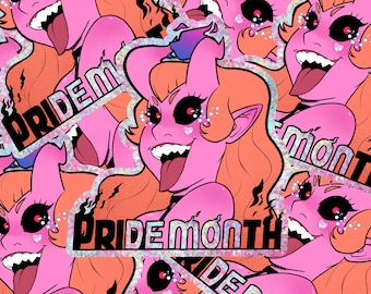 May include: A pink and orange sticker with a cartoon demon with horns and a big smile. The sticker says "PRIDEMONTH" in black letters with a glittery background.