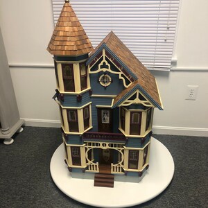 Rotating dollhouse display table hot sale