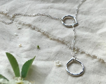 Silver lariat necklace with lotus detail