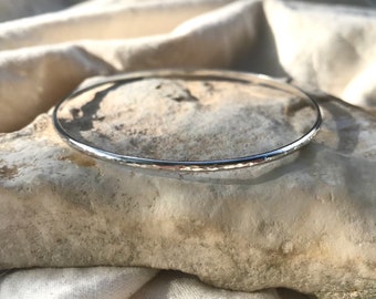 Recycled silver bangle in a hammered finish