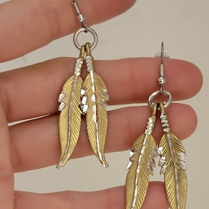 Double gold feather earrings