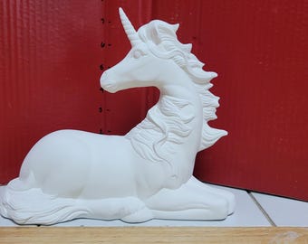 Rare unicorn lying down with ribbons bisque ready to paint