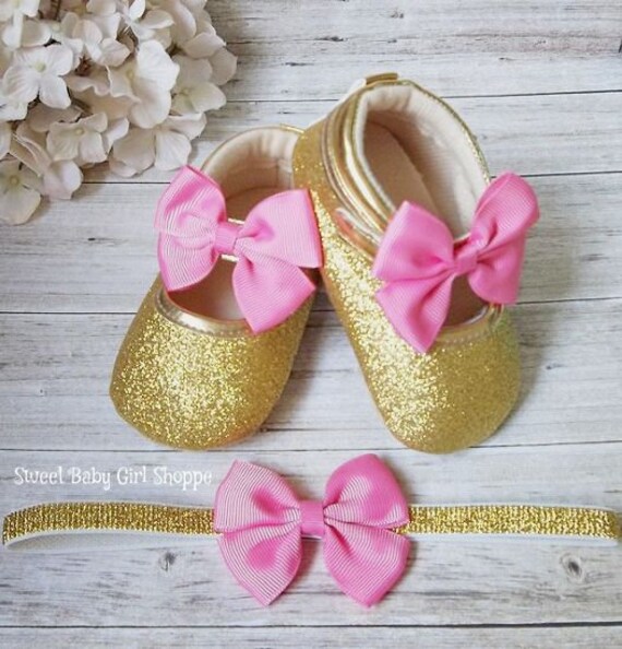 pink and gold baby shoes