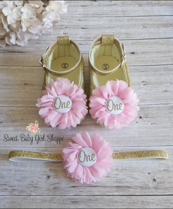 pink and gold baby shoes