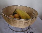 Basket has fruit or flower pot containing braided Wicker natural structure and stainless steel metal base, vintage 90s. Deco modern, industrial, chic, nature