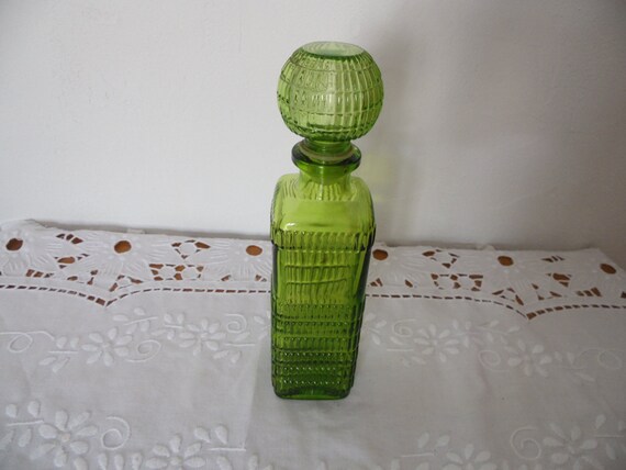 Large chiseled molded glass bottle with cap, tran… - image 1