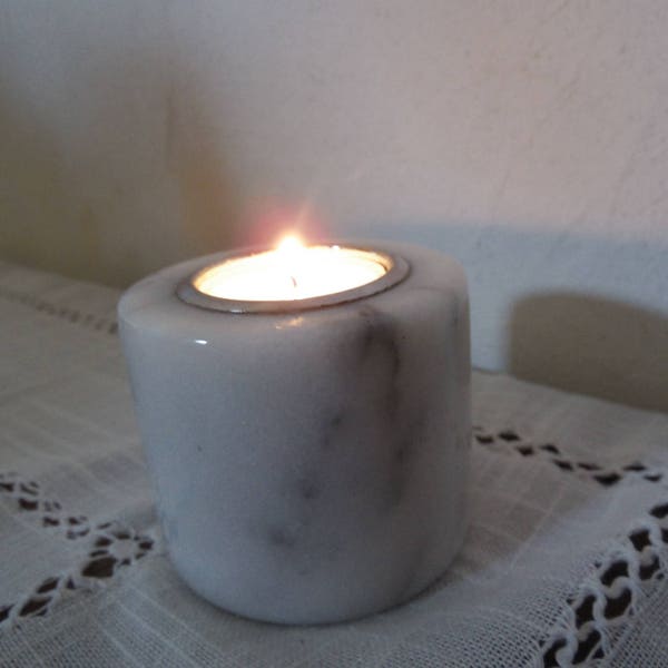 White marble candle holder with gray veins, marble photophore, old marble lighter up cycling, minimalist, raw, chic, simple deco.