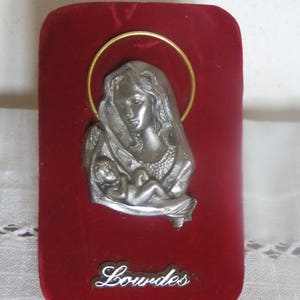 Virgin and child in tin, handmade, souvenir of Lourdes, pelerinage, religious trinket, chretien, to pose or hang, on velvet background