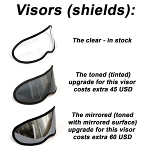 May include: Three motorcycle helmet visors: a clear visor, a tinted visor, and a mirrored visor. The tinted and mirrored visors are upgrades and cost extra. The clear visor is in stock.