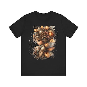 May include: Black t-shirt featuring a detailed illustration of a fairy with steampunk-inspired elements. The fairy has elaborate hair, wings, and adornments with gears and glowing orbs. The artwork is rendered in warm, earthy tones.
