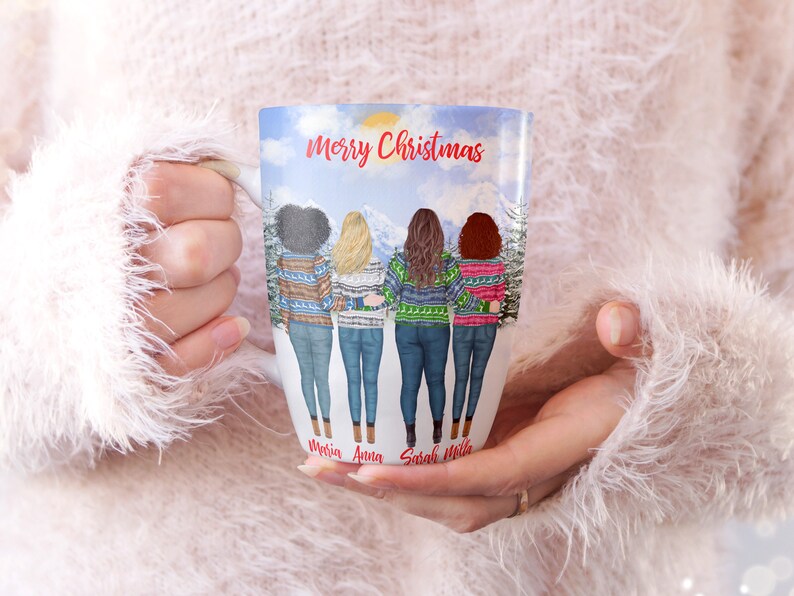 May include: White ceramic mug with a winter scene featuring four women wearing colorful sweaters and jeans. The text "Merry Christmas" is at the top of the mug. The names "Maria, Anna, Sarah, and Hila" are written at the bottom of the mug.
