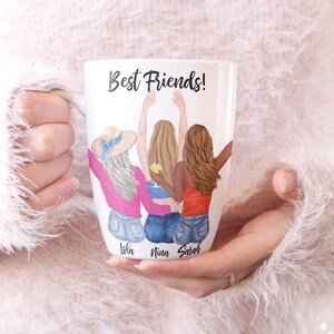 May include: White ceramic mug with a colorful illustration of three friends with their backs to the viewer. The text "Best Friends!" is at the top of the mug. The names "Lola", "Nina", and "Sarah" are written below the friends.