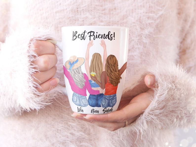 May include: White ceramic mug with a colorful illustration of three friends with their backs to the viewer. The text "Best Friends!" is at the top of the mug. The names "Lola", "Nina", and "Sarah" are written below the friends.