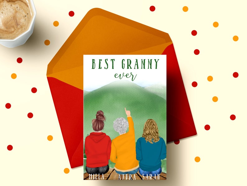 May include: A card with a watercolor background of a green mountain with three women standing in front of it. The women are wearing red, yellow, and blue shirts. The text on the card reads "BEST GRANNY ever" with the names "MILLA, AURA, SARAH" at the bottom.