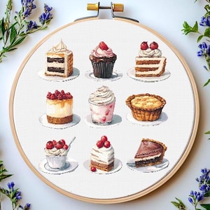 May include: A collection of nine different desserts on white plates, including cakes, cupcakes, cheesecakes, and a pie. The desserts are decorated with berries and whipped cream.