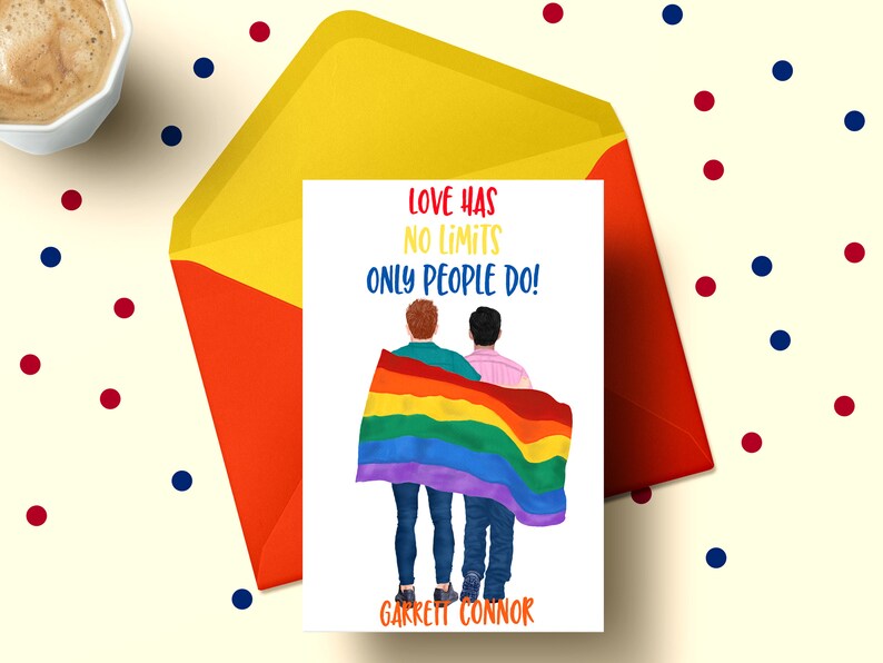 May include: A card with a rainbow flag and two people standing behind it. The text on the card reads "Love has no limits only people do!" and "Garrett Connor".