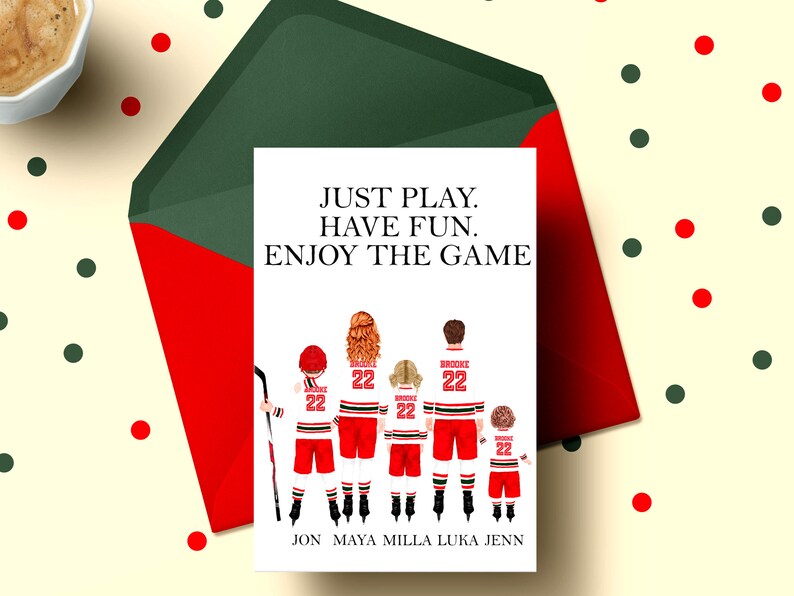 May include: A white card with a red and white hockey player illustration. The text on the card reads "JUST PLAY. HAVE FUN. ENJOY THE GAME". Below the illustration are the names "JON MAYA MILLA LUKA JENN".