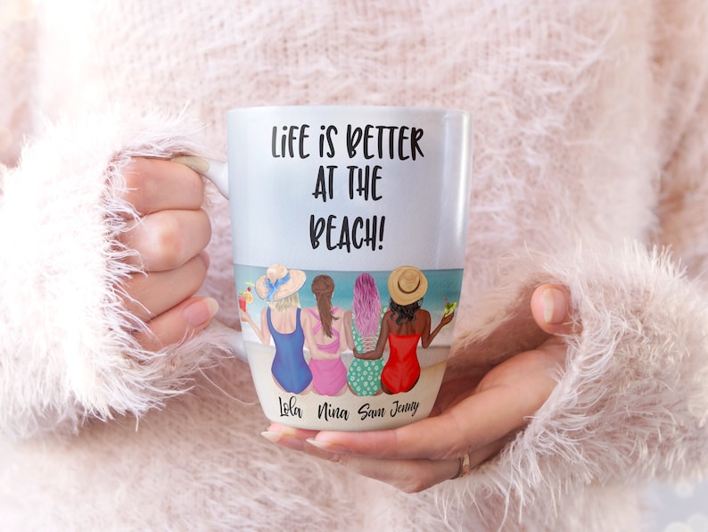 May include: White ceramic mug with a black and white graphic of four women in swimsuits sitting on a beach. The text "Life is better at the beach!" is printed on the mug. The names "Lola, Nina, Sam, Jenny" are printed below the graphic.