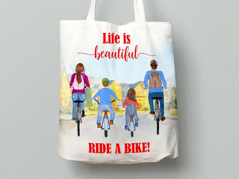 May include: White tote bag with a colorful illustration of a family riding bikes. The text "Life is beautiful" and "RIDE A BIKE!" are in red. The bag has a light blue and yellow background.