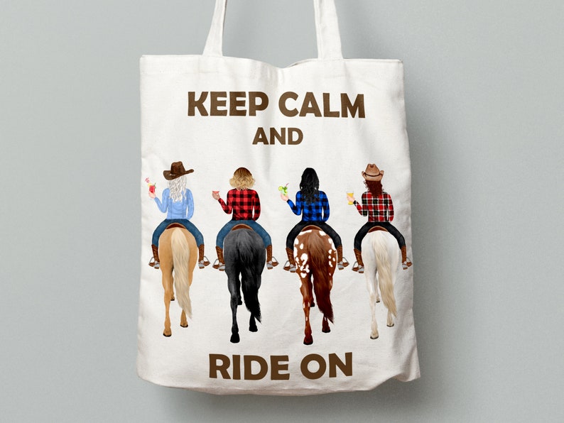 May include: A white tote bag with brown text that reads "Keep Calm and Ride On". Four women are riding horses in the background. The women are wearing cowboy hats and plaid shirts.