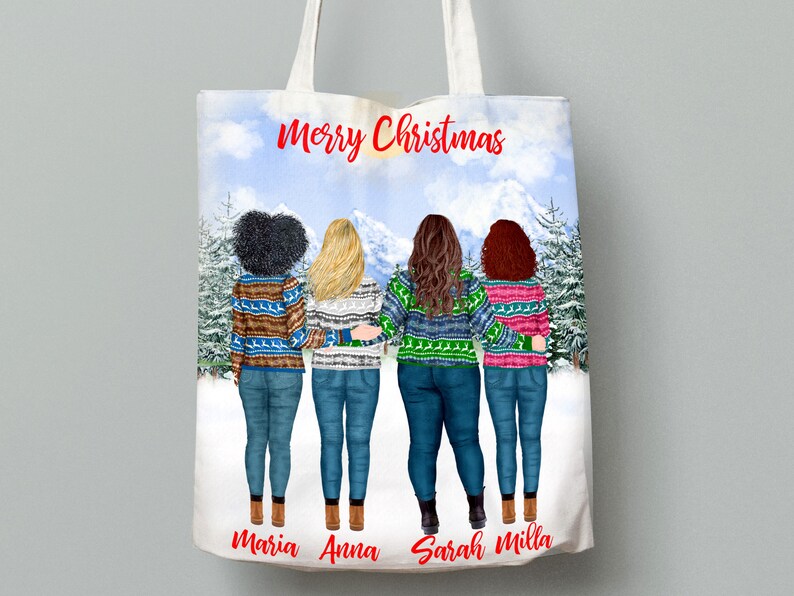 May include: A white tote bag with a winter scene featuring four women wearing colorful sweaters and jeans. The text "Merry Christmas" is printed in red at the top of the bag. The names "Maria", "Anna", "Sarah", and "Milla" are printed at the bottom of the bag.