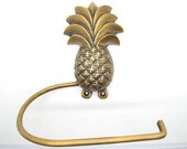 Pineapple bathroom decor. Loo roll holders made from solid brass supplied with fitting screws.Choose from 5 designs.
