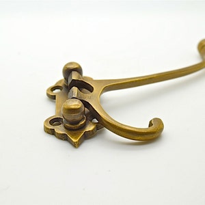 art deco folding coat hooks, Bathroom towel, clothes hooks. Boat yacht hooks. Cabinet hardware, cupboard drawer pulls.