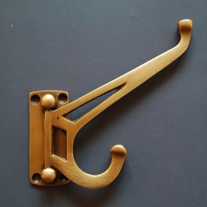 Robe Hooks. Solid brass folding / space saving wall and door hooks. Ideal for bathrooms, hallways and bedrooms. Supplies with screws.