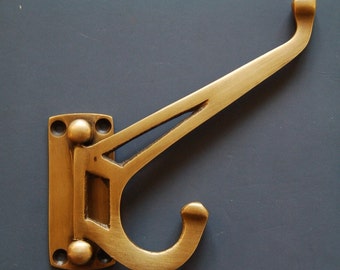 Robe Hooks. Solid brass folding / space saving wall and door hooks. Ideal for bathrooms, hallways and bedrooms. Supplies with screws.