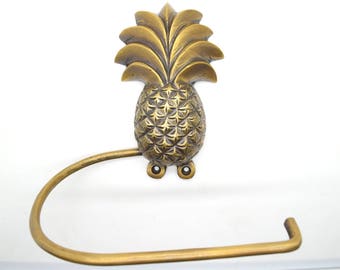 Pineapple bathroom decor. Loo roll holders made from solid brass supplied with fitting screws.Choose from 5 designs.