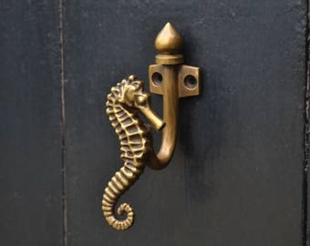 nursery decor wall hooks. Seahorse brass towel hooks. Bathroom and hallway coat hooks in brass, great for small gift ideas and home decor