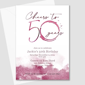 May include: A pink and white watercolor background with a wine glass ring design. The text "Cheers to 50 years" is written in a script font. The invitation details a 50th birthday party for Jackie on December 2, 2024, at 6:00 pm at Cavern on East Third, 123 Address Street, Chattanooga, Tennessee. RSVP by November 20 to 123-456-7890.