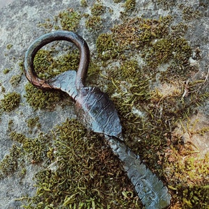 hand-forged bottle opener with leaf