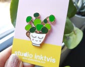 Pilea enamel pin badge white. This pilea peperomioides is a unique gift idea for mom, a gardener or any plant lover.