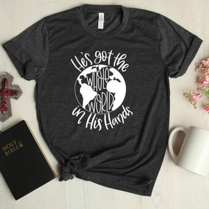 He’s got the whole world in his hands.God. Church shirt. Bella Canvas .Screen Print. Prayerfully